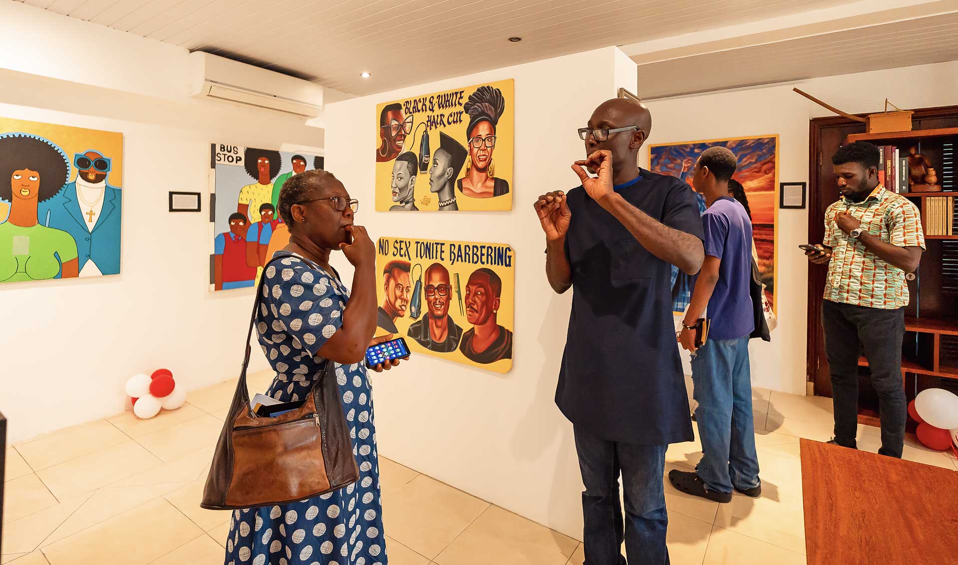 Dr Frimpong (right) speaking to a guest at the Centre for African Popular Culture