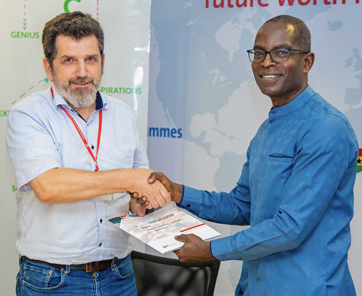 Ashesi President Dr. Patrick Awuah receives signed agreement from Dr. Christian Jahn, the Head of the Private and Financial Sector Program at GIZ